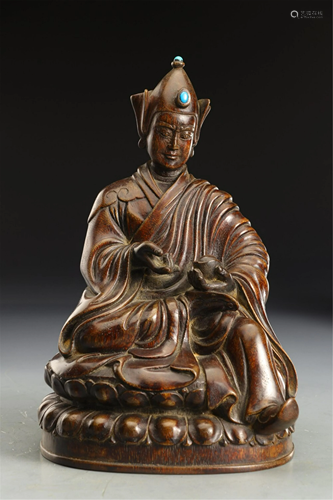 A CARVED CHENXIANG WOOD SEATED PADMASAMBHAVA