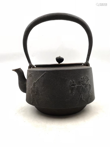 A JAPANESE STYLE INCISED FIGURES STORY IRON TEA POT