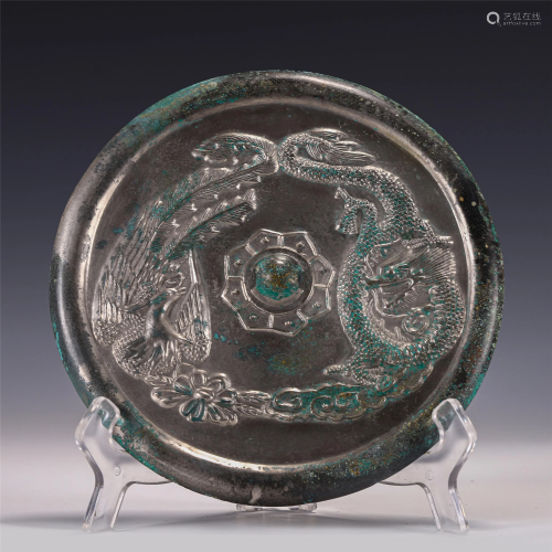 A CHINESE INCISED DRAGON PHOENIX MIRROR