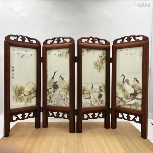 A CRANE-AND-PINE INLAID HARDWOOD FOUR-FOLDING SCREEN