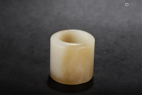 A CARVED JADE THUMB RING