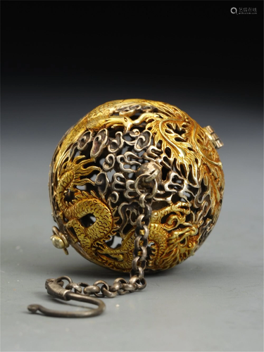 A HOLLOW OUT SILVER GILT DRAGON PHOENIX INCENSE CAGE