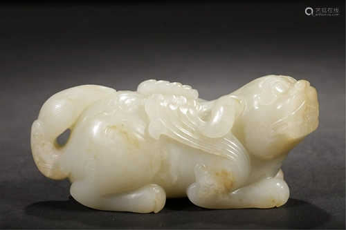 A WHITE JADE CARVED MYTHICAL BEAST HAND PIECE