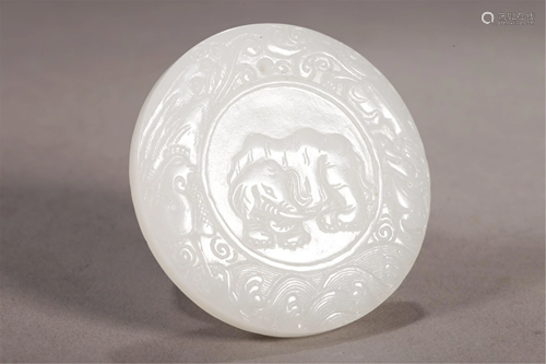 A CARVED ELEPHANT CIRCULAR JADE PLAQUE