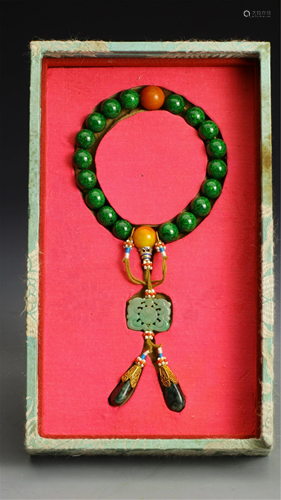 A STRING OF GREEN COLORED QIUJIAO PRAYER BEADS