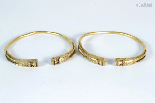 A Pair of Yellow Gold Bracelets