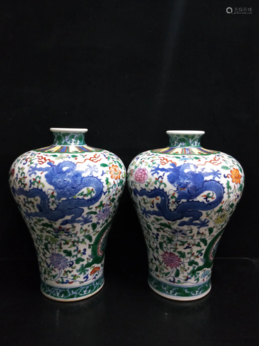 A pair of dragon plum vases with flowers and dragons