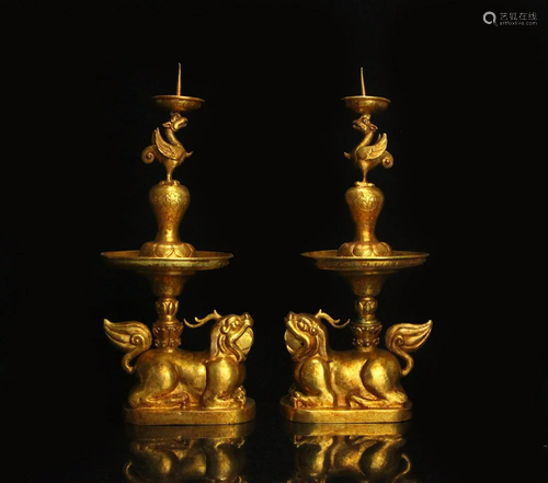 The collection of a pair of gilt dragon and phoenix wax