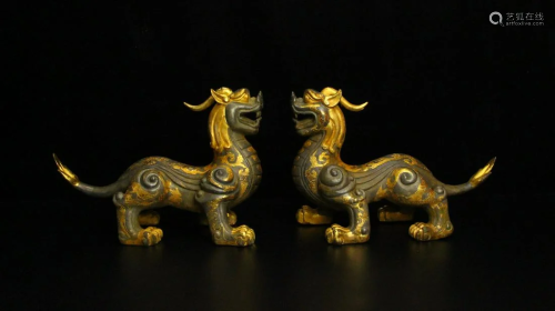 A pair of partial gilt beasts from the Han Dynasty