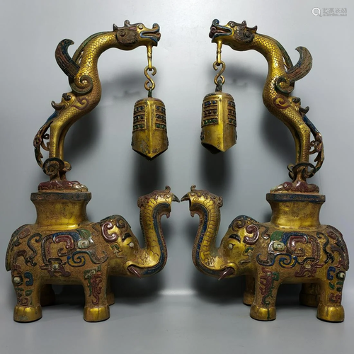 A pair of bronze painted dragon and elephant clocks in