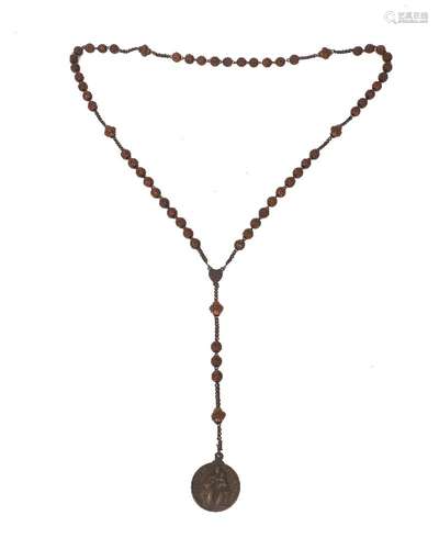 A late Victorian Rosary, the beads carved from coquilla nuts...