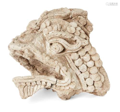 A carved stone fragment of a dragon head, possibly Sri Lanka...