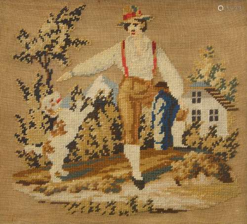 A Victorian needlepoint picture depicting a man and his dog,...