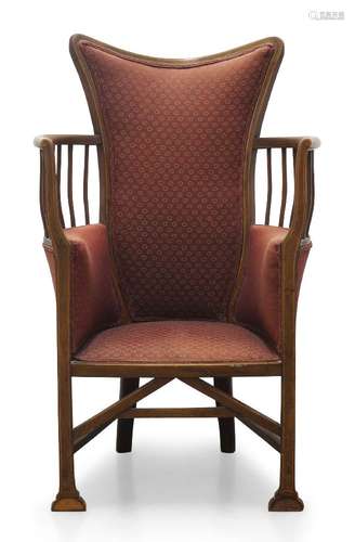 An Edwardian armchair in the manner of Liberty & Co, the sha...