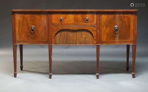 A mahogany and crossbanded serpentine sideboard, second half...