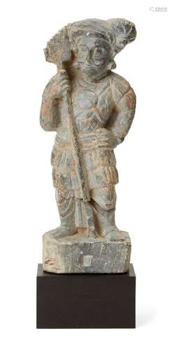 A Gandhara figure of a soldier, 4th-5th century, crudely car...