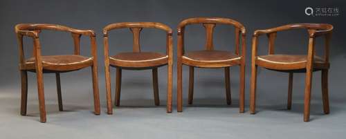 A set of four walnut armchairs, early 20th Century, with cur...