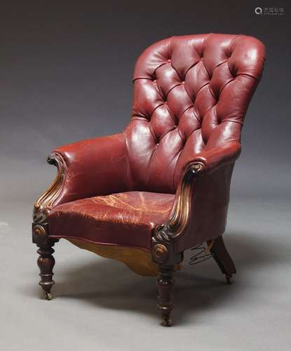 A Victorian button back armchair, upholstered in burgundy le...