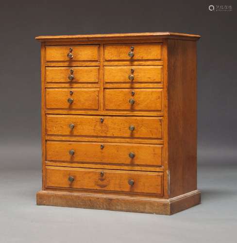 An Edwardian oak collector’s cabinet, with six short drawers...