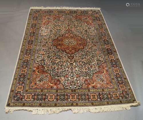 A Modern Kashan silk rug, with pole medallion in an ivory fl...