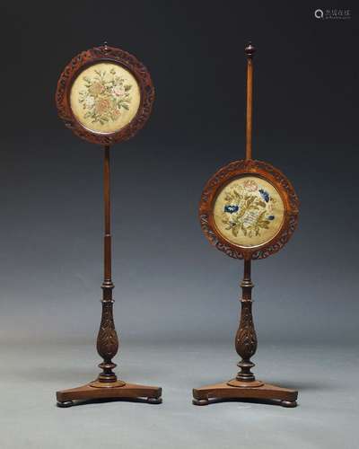 A pair of Victorian mahogany pole screens, with circular fre...