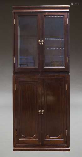 A mahogany and glazed display cabinet on cupboard base, seco...