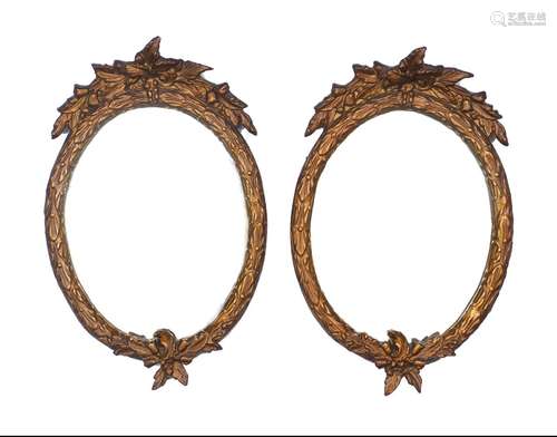 A pair of gilt-composition mirrors, late 20th century, with ...