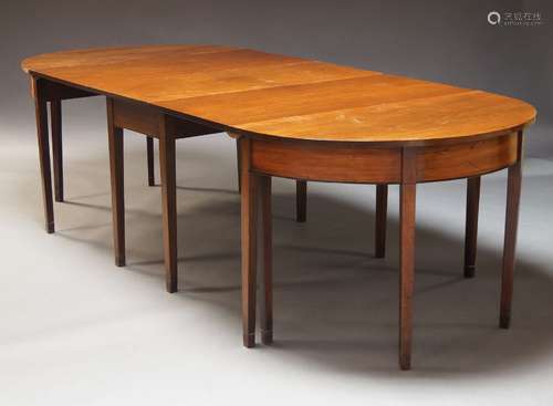 A mahogany and line inlaid D-end dining table, 19th Century,...