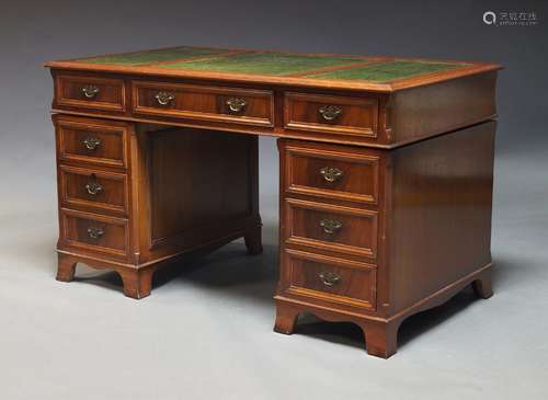 A mahogany pedestal desk, late 20th Century, the rectangular...