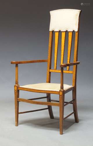 An Edwardian mahogany and satinwood inlaid armchair, the faw...