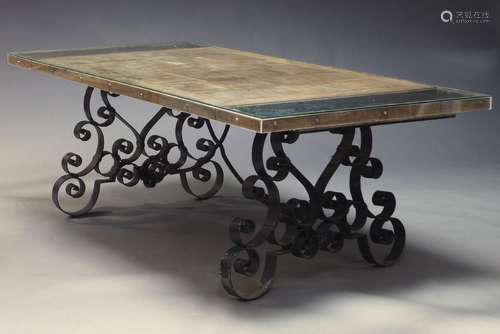 A large French wrought iron garden table, early 20th Century...