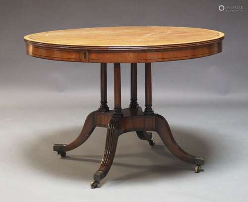 A mahogany and Macassar banded tilt top table in the Georgia...