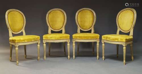 A set of four Louis XVI style cream painted side chairs, mid...