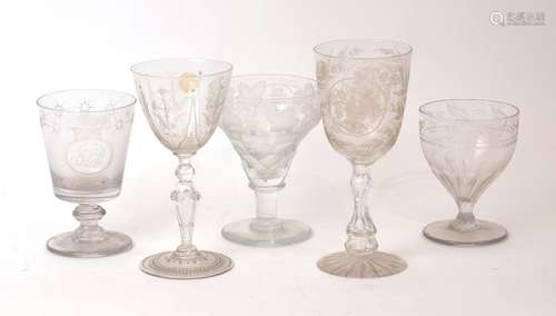 A group of five large engraved stemmed glasses, 19th century...