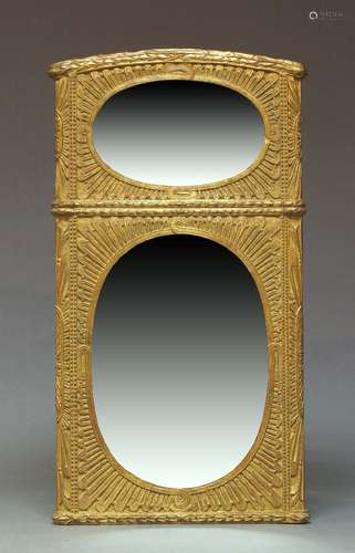 A gilt framed wall mirror, late 20th Century, of arched form...