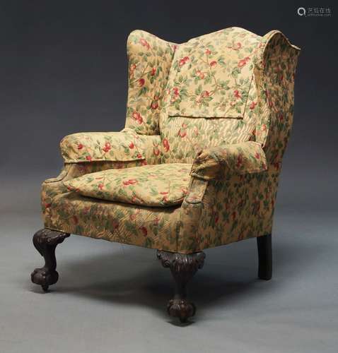 A Victorian wing back arm chair, upholstered in floral fabri...