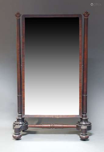 A William IV mahogany cheval mirror, the rectangular plate f...