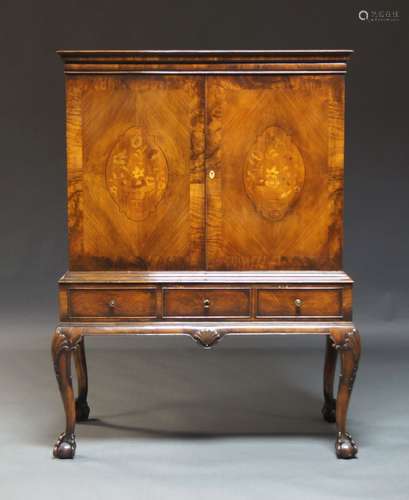 A walnut and inlaid cabinet on stand, early to mid 20th Cent...