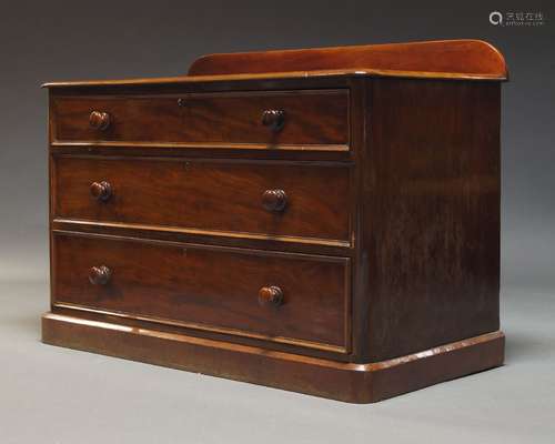 A Victorian mahogany chest, the top with raised back, over t...