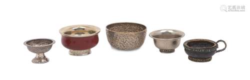 A group of five Tibetan bowls, to include a white metal bowl...