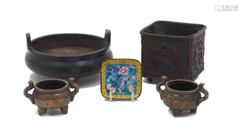 A Chinese low twin handled bronze censer, raised on tripod f...