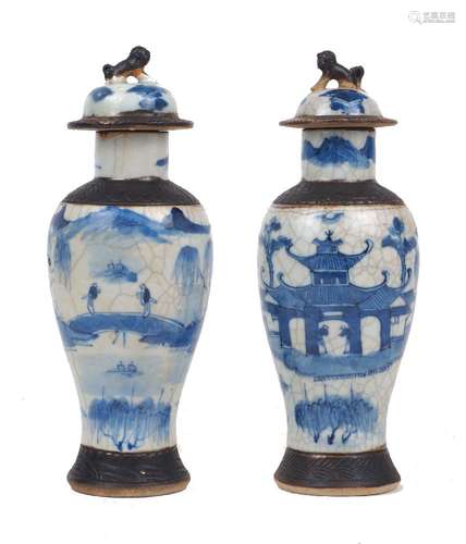 A pair of Chinese porcelain baluster vases and covers, late ...