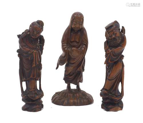 Three Chinese carved hardwood figures, early 20th Century, i...