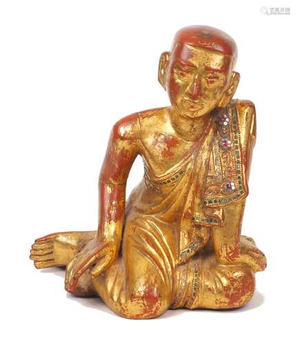 A Thai giltwood Buddha, early 20th century, depicted kneelin...