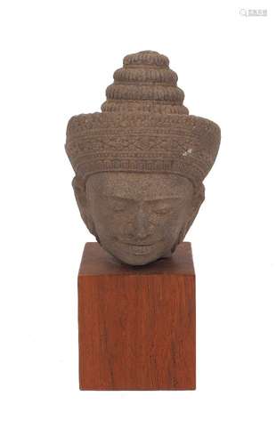 A Khmer sandstone head of Vishnu, Angkor Wat-Style, carved w...