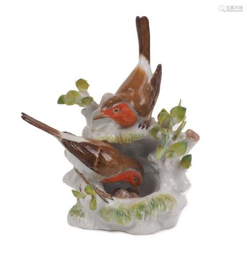 A Meissen bird group, 20th Century, depicting two robins ten...