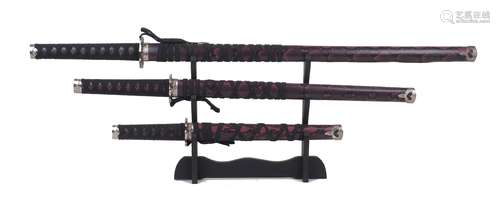 A set of three replica Samurai swords, 20th Century, compris...