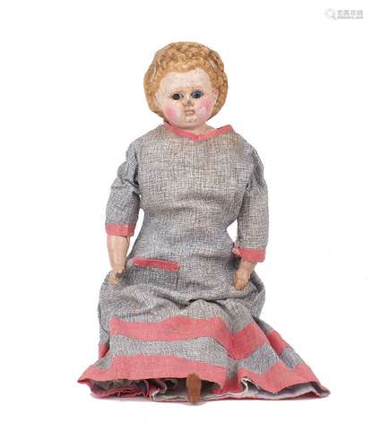 A wax over composition pumpkin head doll, circa 1860, with w...