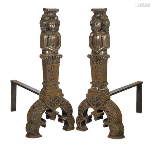 A pair of large cast iron fire dogs, 17th century style, the...