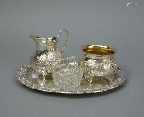 MILK CREAMER, SUGAR BOWL AND SWEETENER BOWL ON A TRAY